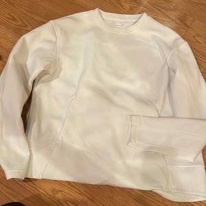 White Lululemon sweater with pockets